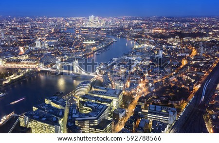 Aerial view of London city with Tower Bridge and Thames river, night scene with long exposure     