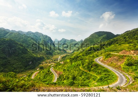 Mountain road in beautiful valley. Ha Giang province. Vietnam Royalty-Free Stock Photo #59280121