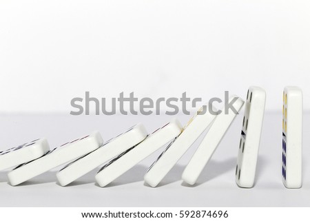 row of domino tiles falling