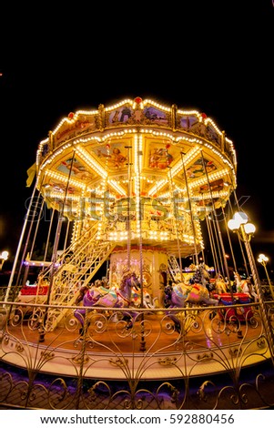 Children's Carousel at an amusement park in the evening and night illumination. amusement park at night. amusement park, picture for the background.