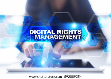 Woman using tablet pc, pressing on virtual screen and selecting digital rights management.