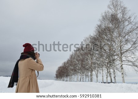 A women photographer is taking photograph
