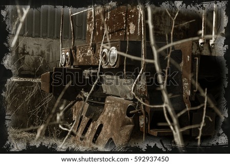 Old rusty train locomotive thrown. Exclusion zone Chernobyl. Zone high radioactivity. Ghost town of Pripyat. Chernobyl disaster. Rusty abandoned Soviet machinery in area of nuclear accident at plant