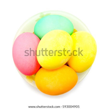 Colorful easter eggs in bowl isolated on white background
