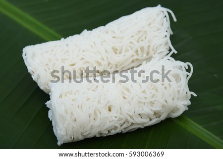 Noolappam/Idiyappam/rice noodles, a popular traditional steam cooked Kerala breakfast dish with hot and spicy roast curry on a houseboat, Alleppey, India. South Indian food. noolputtu Sri lankan