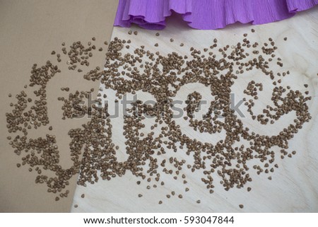 Photo paper background pink brown paper and light wood with buckwheat and word free