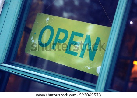 Sign on open door cafe