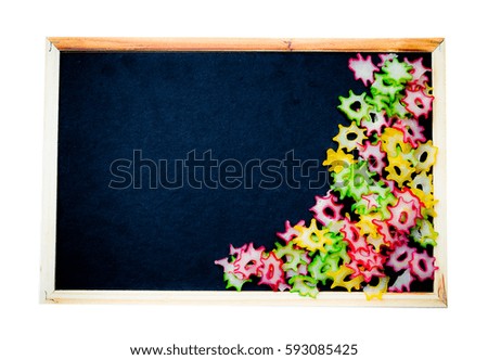 blackboard with colorful frame by dried food on isolated white background  