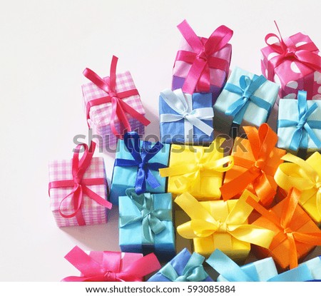 Gift box. White background. Color pink,yellow,orange and blue.