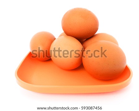 Chicken eggs on a plate isolated on white background
