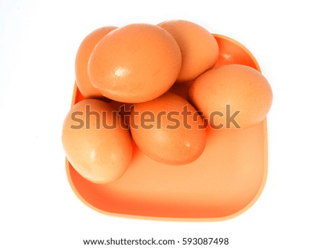 Chicken eggs on a plate isolated on white background