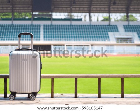 Travel suitcase with the stadium background, Stadium concept, Travel bag
