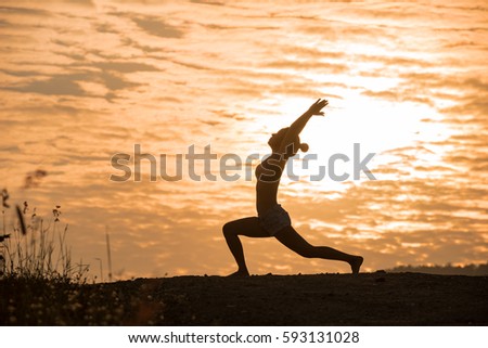 Silhouette Asia woman yoga on sunset. Sunset sky background