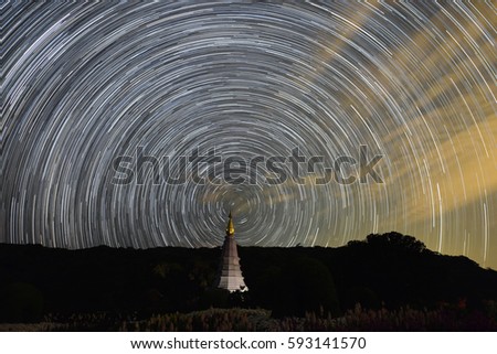Star trail shot at Doi Intanon, Chiang Mai, Thailand. A star trail is a type of photograph that utilizes long-exposure times to capture the motion of stars in the sky due to the rotation of the Earth