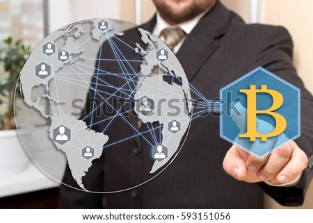 Businessman, choosing bitcoins clicks on the touch screen in the web network. The latest technology work with Finance in the networks.The concept of distribution of bitcoins. 