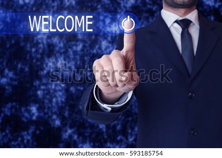 Businessman clicking welcome button.