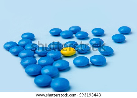 Picture of a lot of colorful sweeties candy over blue table background.