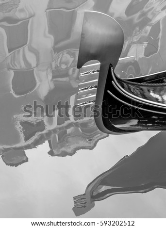 Detail of the bow of a traditional Venetian gondola, Venice, Italy, in black and white