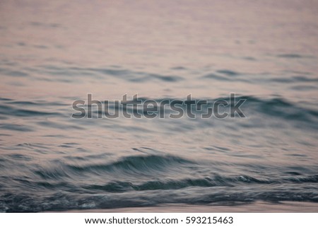Sunlight reflection on sea wave surface at dawn