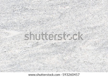Real granite stone texture in top view. Natural material with gray abstract texture pattern of mineral, quartz. Smooth surface for decorative wall, floor, countertop, slab in bathroom and kitchen.
