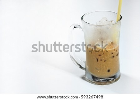 Latte ice coffee in glass isolated on white background, Close up latte ice coffee, selective focus, free space for text.