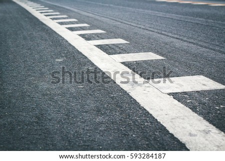 Asphalt surface of road with lines