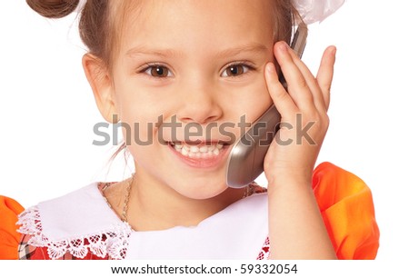 Little girl speaks on phone, isolated on white background.
