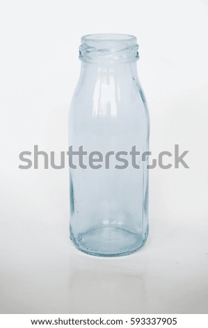Empty blue glass bottle isolated on white background
