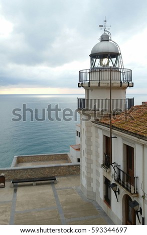 Sea lighthouse on village in Peniscola, Castellon Spain