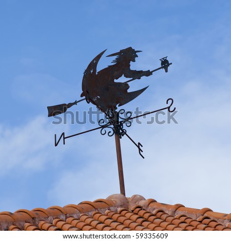 Black Compass wind on red roof
