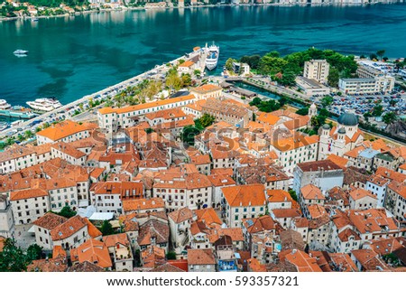 Panoramic view of port, town and mountains in Kotor, Montenegro Royalty-Free Stock Photo #593357321