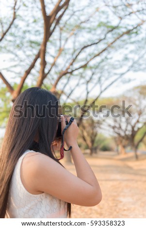 Asian woman take a photo outdoor