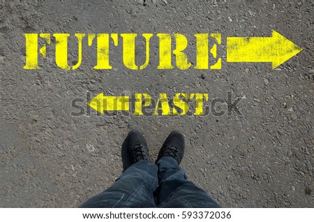 inscription on the pavement past future foot top view of the choice of the way towards the start of the path of doubt
