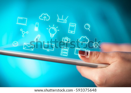 Female hands touching tablet with white technology related icons 