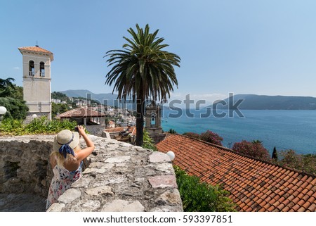 Young Woman Taking Pictures with Mobile Phone in Herceg Novi, Montenegro