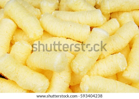 Cheese puff. Cheese puffs snack background texture food pattern.
