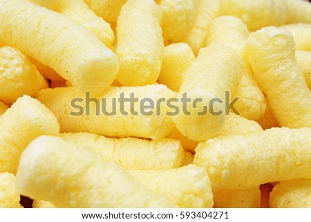 Cheese puff. Cheese puffs snack background texture food pattern.
