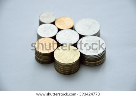 stacks of all kinds of russian coins on a white surface