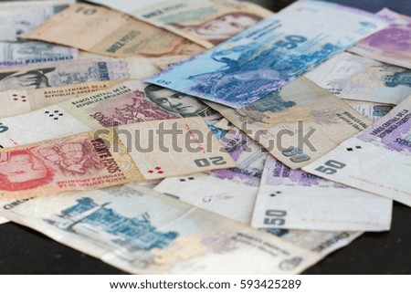 Colorful background of mixed banknotes of south american currencies