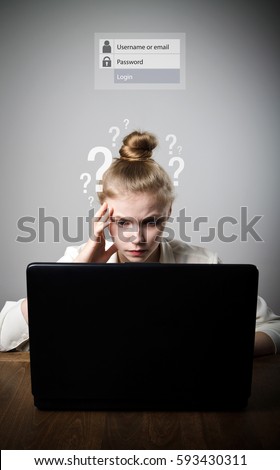 Young slim woman is using a laptop to browse the net. Forgot password concept.