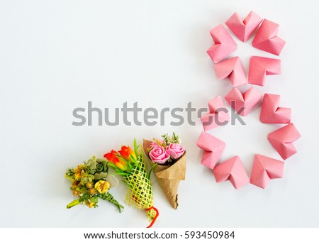 Happy International Women’s Day celebrate on March 8 CARD. rose-color paper hearts shape figure eight 8 on white background