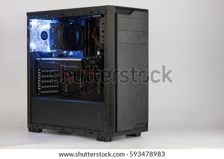Open midi tower computer case with red and blue lighting effects  on white background Royalty-Free Stock Photo #593478983