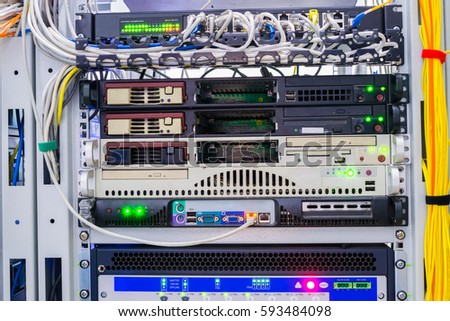 Switches and servers installed in a rack in a data center server room