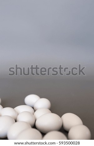 White eggs on gray background