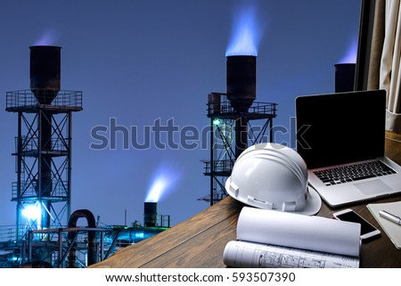 Engineering Industry concept in office with Oil and gas Industry,Refinery at sunset ,Pipelines and petrochemical plant background 