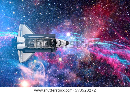 Space Shuttle flight over space stars, galaxies and nebula. Elements of this image furnished by NASA.