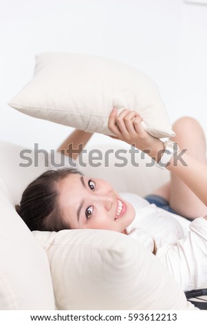 young pretty chinese woman lying on bed