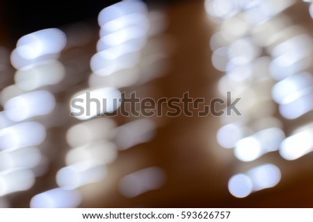 Blurry defocused festive glitter bokeh, shiny lights illumination texture background