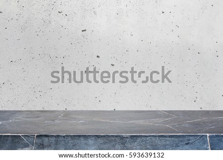 Stone table top and background of grey old concrete wall - can used for display or montage your products.