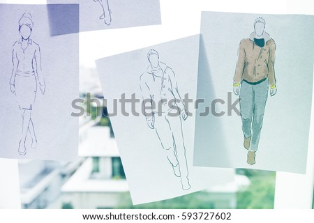 Fashion design sketching paper on the window wall